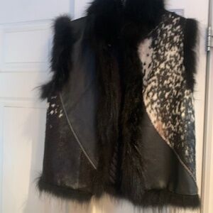 Ladies’ Vest with animal fur and cowhide black quilted on inside . 32” from back